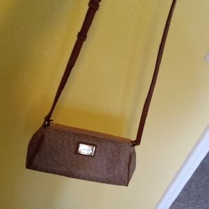 Calvin Klein Brown Leather Crossbody Bag with Cylindrical Design